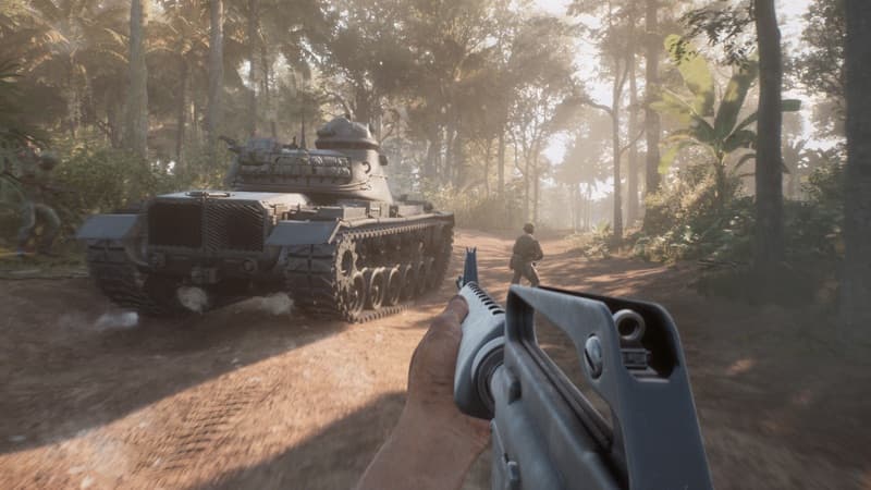 A tank and rifle moving along a jungle road after an explosion